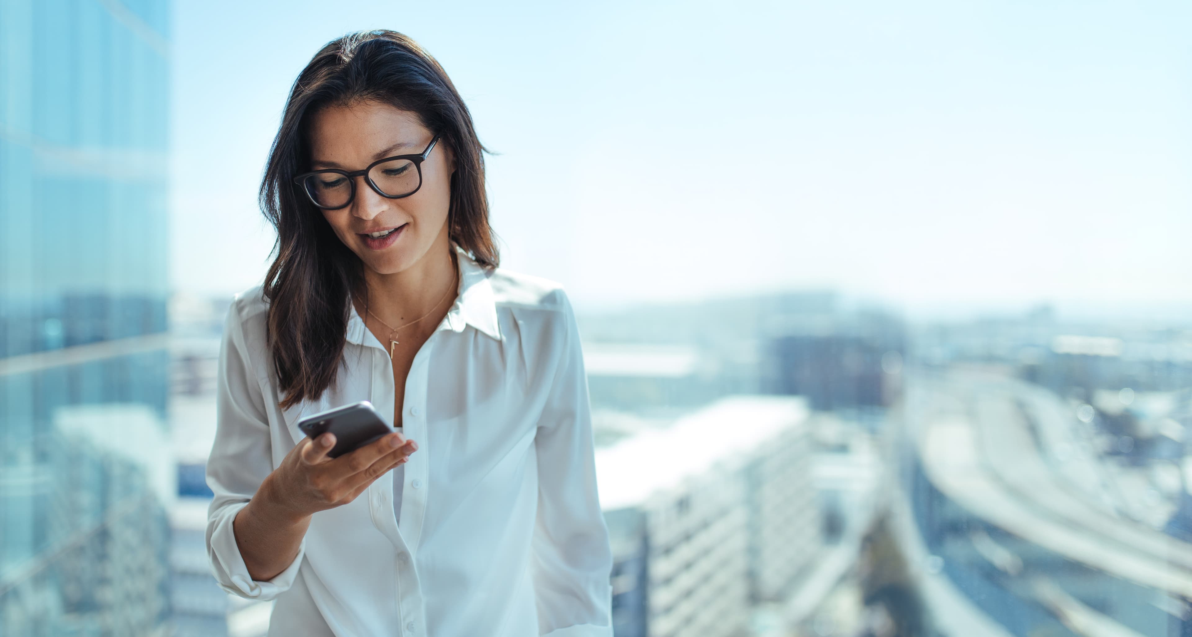 Young businesswoman using her mobile phone